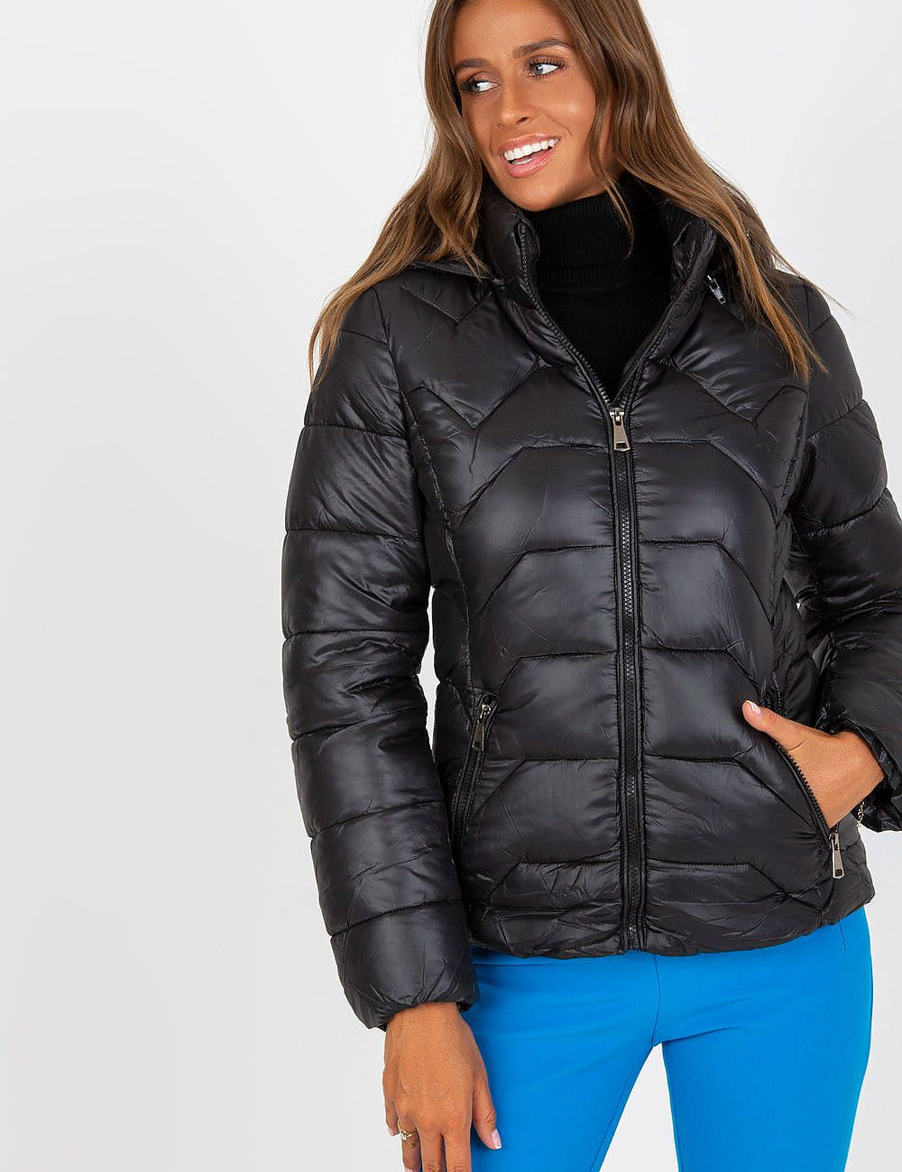 Woman wearing Evelora Quilted Gilet with Detachable Hood, showcasing the sleek black design and modern appeal for stylish urban looks.