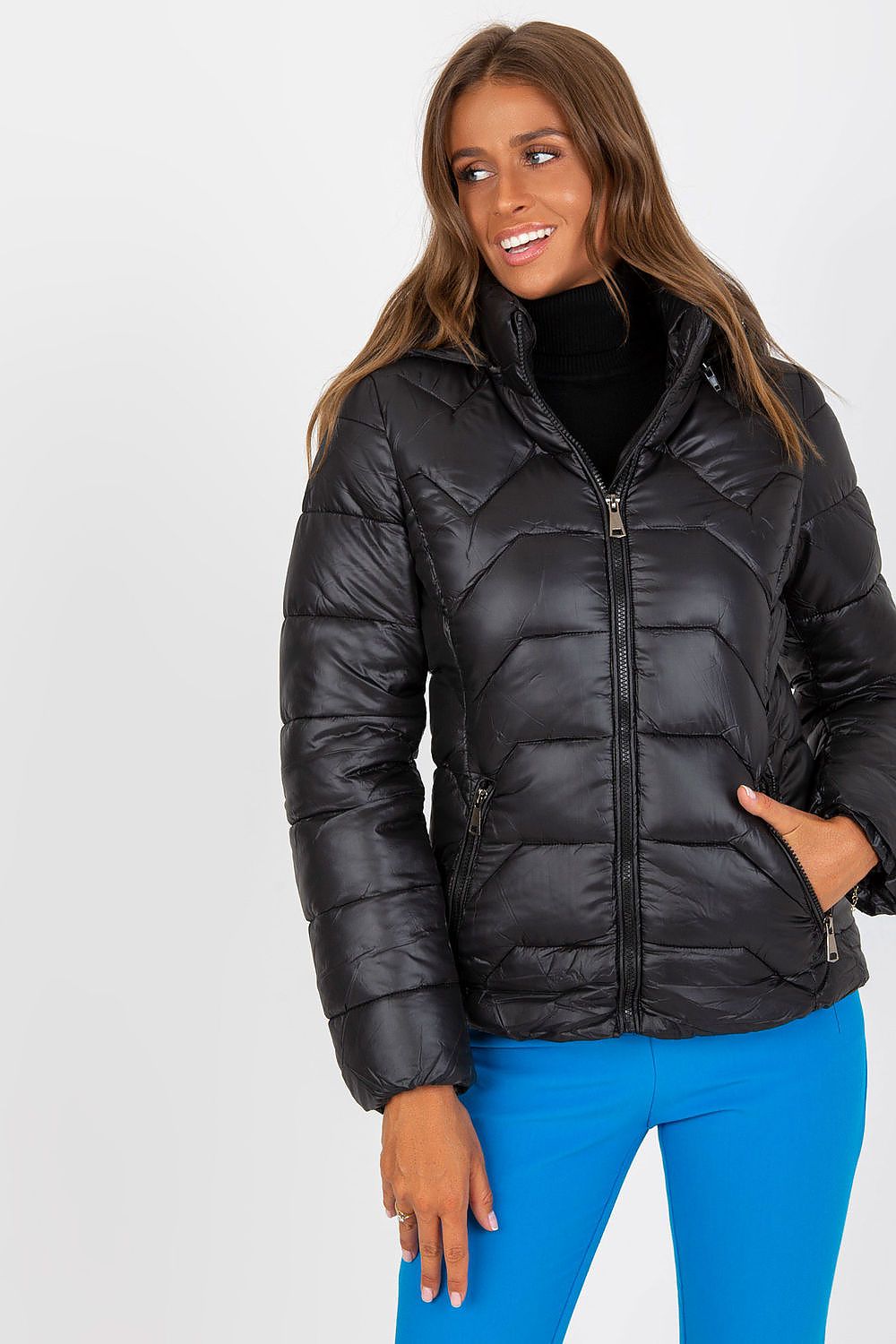 Woman wearing Evelora Quilted Gilet with Detachable Hood, showcasing the sleek black design and modern appeal for stylish urban looks.