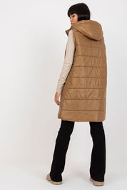 Evrendelle Quilted Longline Vest with detachable hood in brown, shown on a model from the back showcasing sleek silhouette.