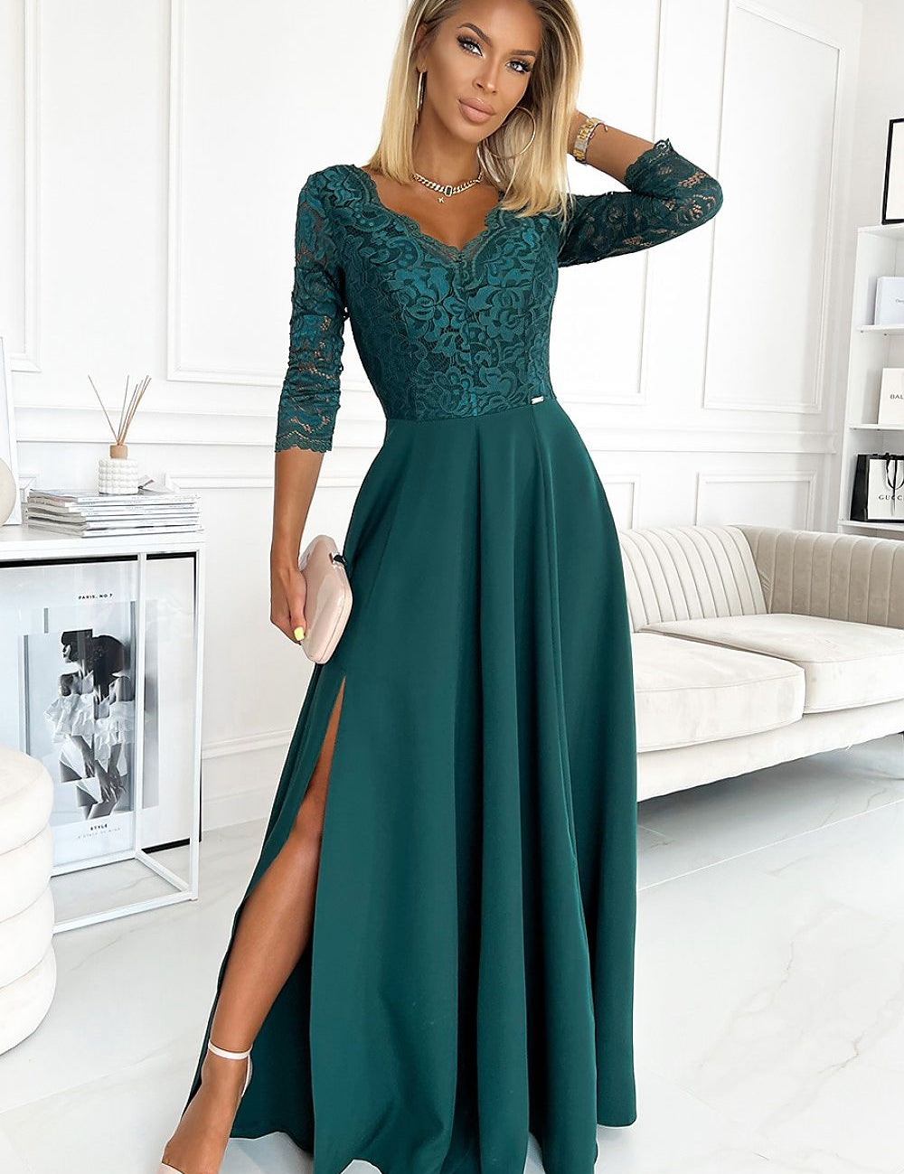 Bottle green lace maxi gown with thigh-high slit and elegant neckline, perfect for formal events like weddings and evening dinners.