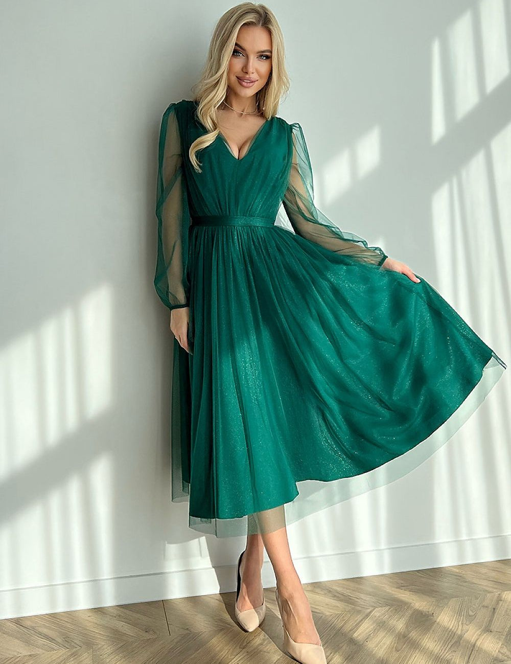 Model wearing green Marleia Mesh-Layered Evening Midi Dress with sheer sleeves and flared skirt.