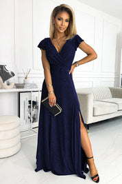 Woman in a Selvianne Navy Glitter Wrap Gown with a thigh-high slit, ideal for weddings and formal events, showcasing elegance and style.