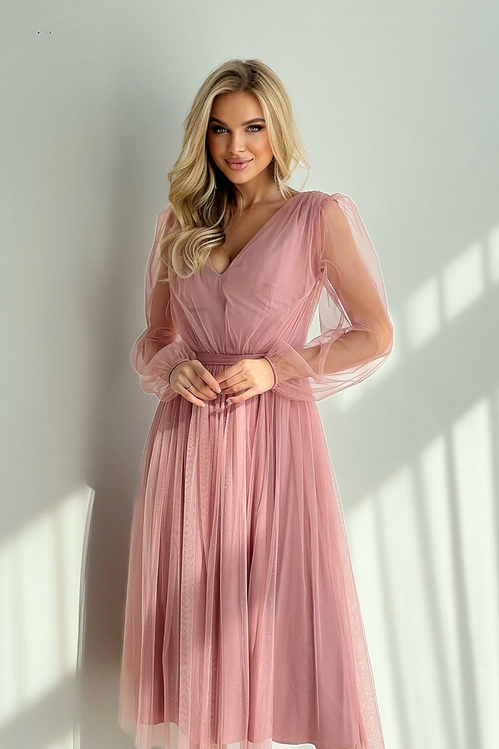 Woman wearing Marleia Mesh-Layered Evening Midi Dress in pink with sheer sleeves and flared skirt.