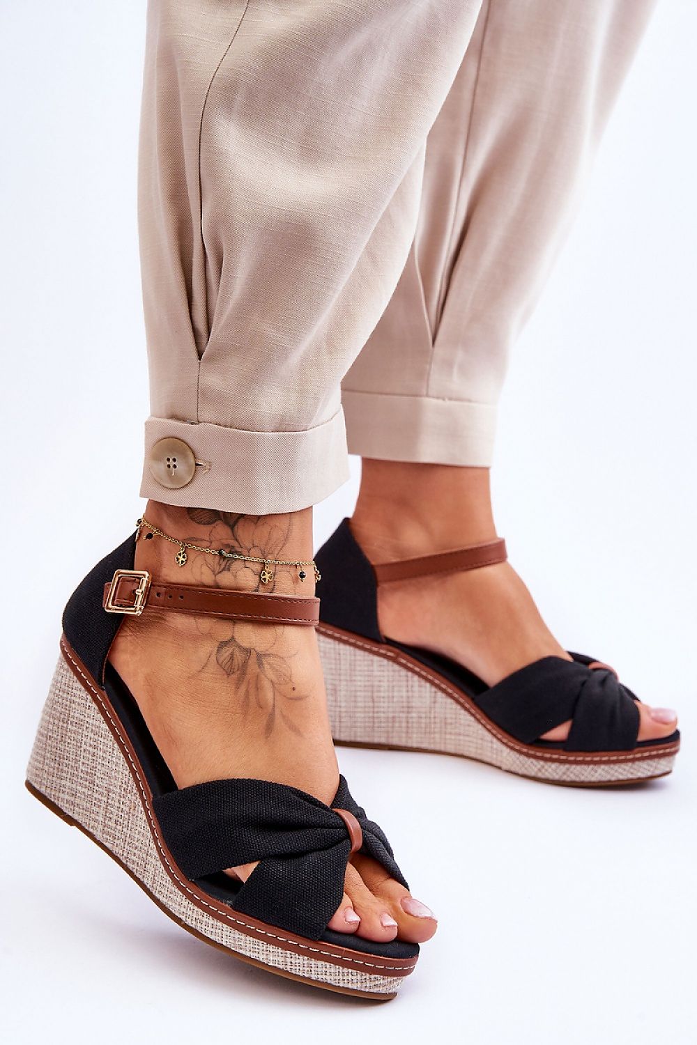 Larvella woven fabric buskins with sculpted heel and ankle strap, perfect for stylish and comfortable summer wear.