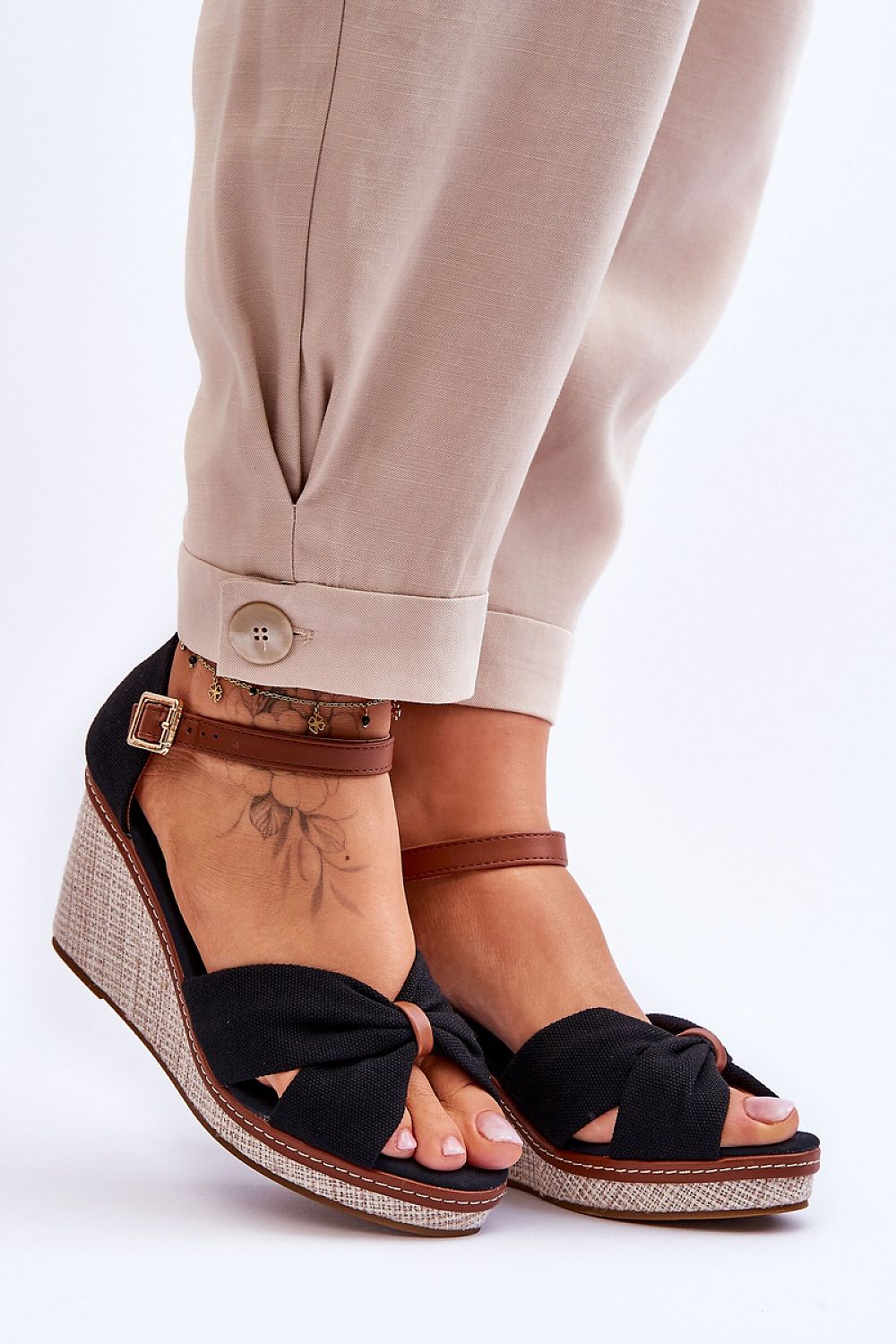 Alt Tag: Larvella Woven Fabric Buskins with buckle-fastened ankle strap and sculpted heel, offering sophisticated comfort.