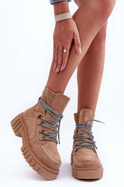 Woman wearing Serrina Eco-Suede Chunky Heel Boots with plush inner lining and block heel, perfect for winter fashion.