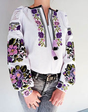 Custom white Ukrainian Vyshyvanka blouse with vibrant traditional embroidery for women.