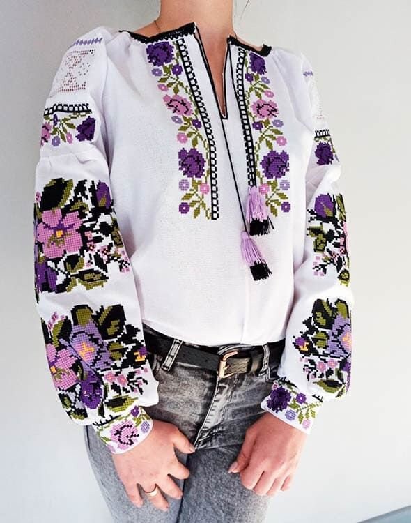 Custom white Ukrainian Vyshyvanka blouse with vibrant traditional embroidery for women.