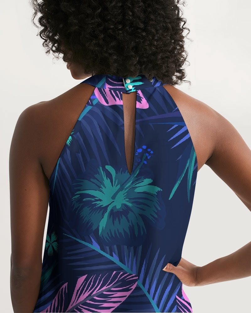 Back view of the Palm Drift Halter Dress featuring a vibrant palm leaf print and pearl button neckline, evoking tropical elegance.