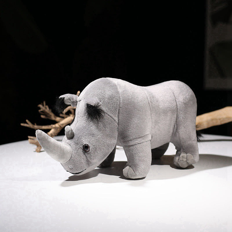 Cute rhino plush toy made of soft fabric, perfect for teenagers, displayed on a table.