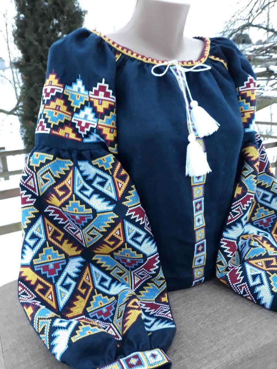 Dark blue Ukrainian Vyshyvanka blouse with colorful folk embroidery and tassels for women.