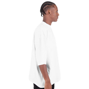 Men's oversized drop-shoulder crewneck t-shirt in white side view, featuring a relaxed fit with durable heavyweight cotton and streetwear style.