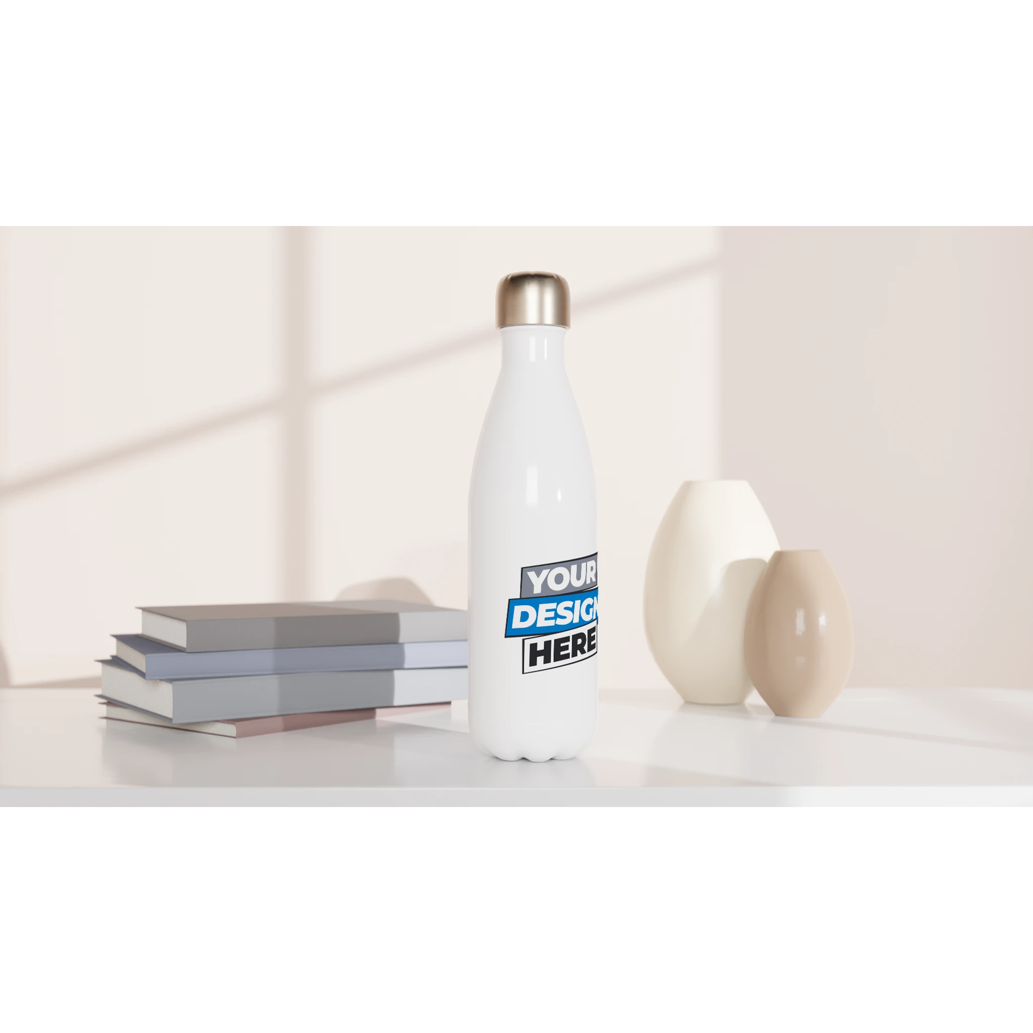 Print on demand stainless steel water bottle 17oz with customizable surface, placed on a table with books and decorative vases.