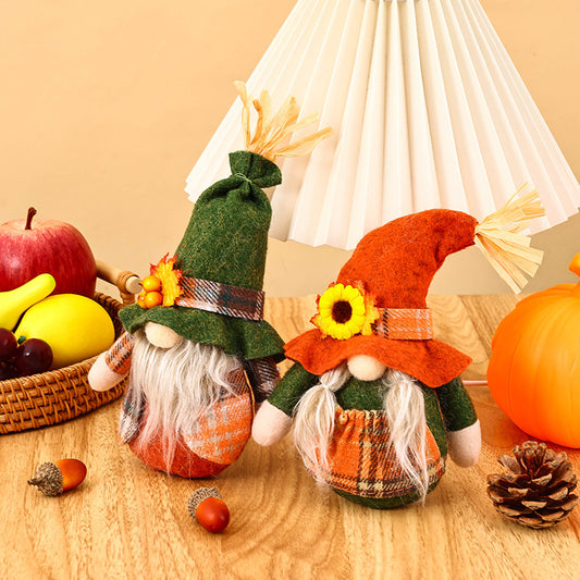 Faceless Old Man Dolls with Green and Orange Hats for Thanksgiving, Surrounded by Fall Fruits and Decor.