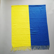 Luxurious Designer Ukraine Flag Cashmere Shawl in blue and yellow featuring elegant tassels, perfect for winter elegance.
