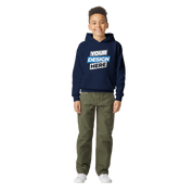Youth wearing a navy Terylo Fleece Hoodie for kids, featuring a "Your Design Here" print, standing with hands in pockets, ideal for play or school.