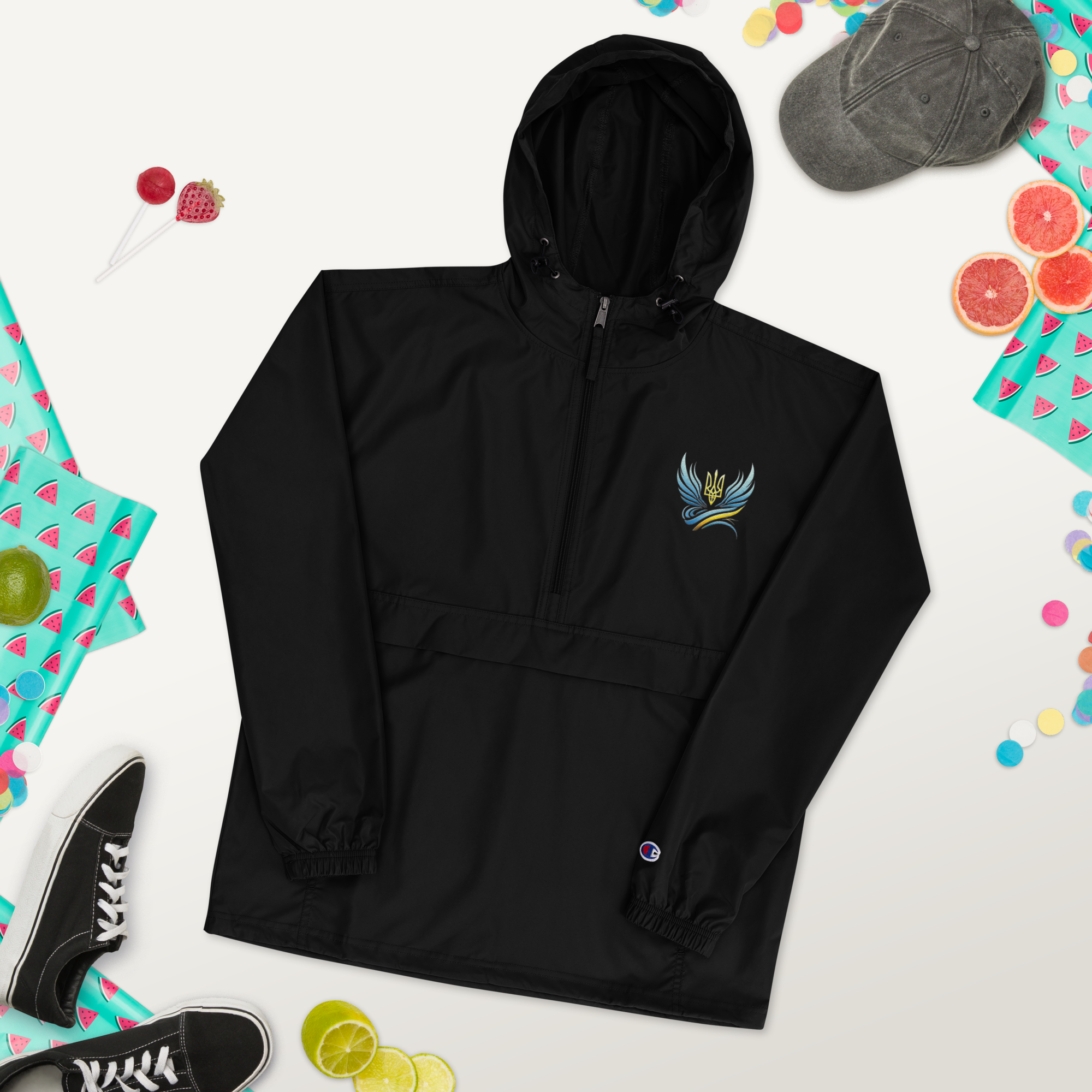 Black embroidered Champion packable jacket from Ukrainian Vibe Trizub Collection with hood and kangaroo pocket, stylishly compact.