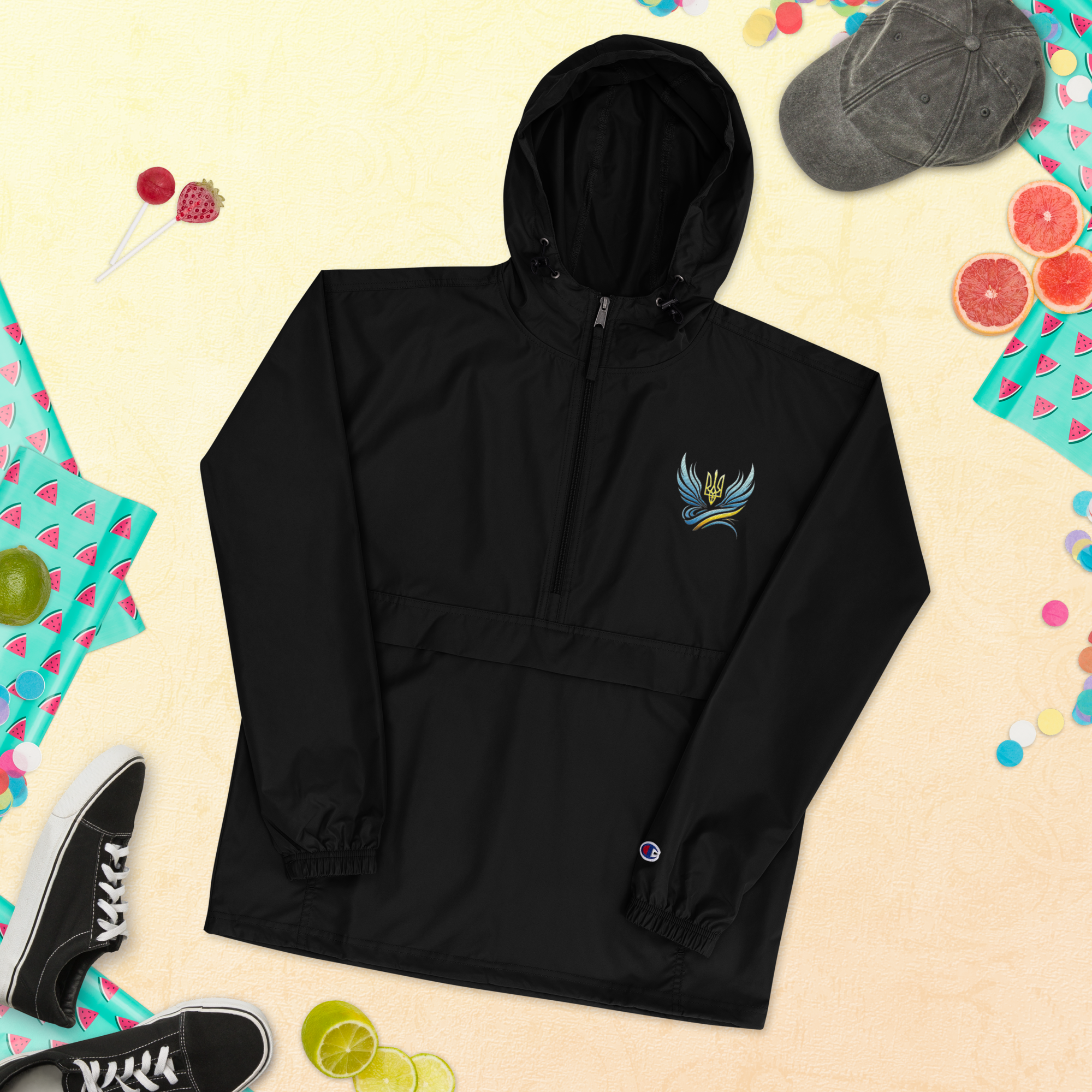 Women's black embroidered Champion packable jacket from Ukrainian Vibe Trizub Collection, featuring trident emblem.