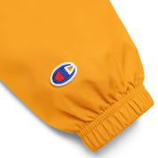 Orange embroidered sleeve detail of Ukrainian Vibe Trizub Collection Champion jacket for women, featuring durable polyester fabric.