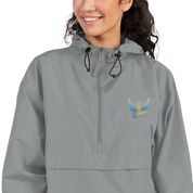 Woman wearing Ukrainian Vibe Trizub Collection embroidered Champion packable jacket, gray with Trizub symbol