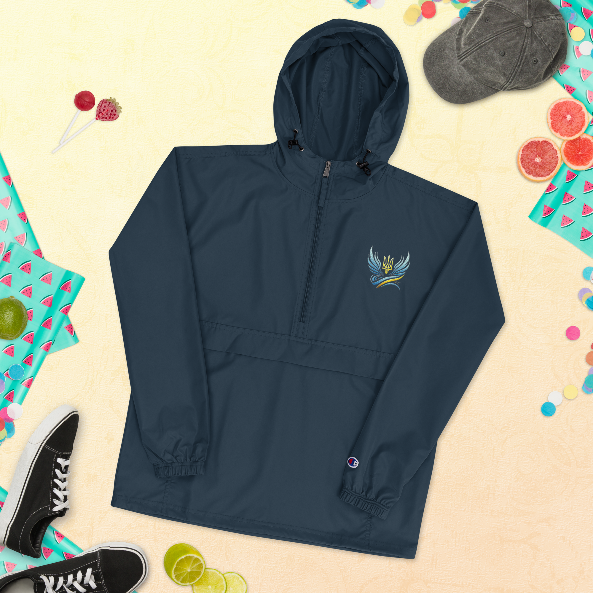 Navy Champion packable jacket with Ukrainian embroidery, featuring hood and pouch pocket, from the Trizub Collection for women.