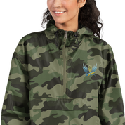 Woman wearing Ukrainian Vibe Trizub Collection camo jacket with embroidery, Champion packable style, perfect for wind and rain protection.
