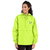 Woman wearing Ukrainian Vibe Trizub embroidered Champion packable jacket, neon green, hood, polyester, wind and rain-resistant.
