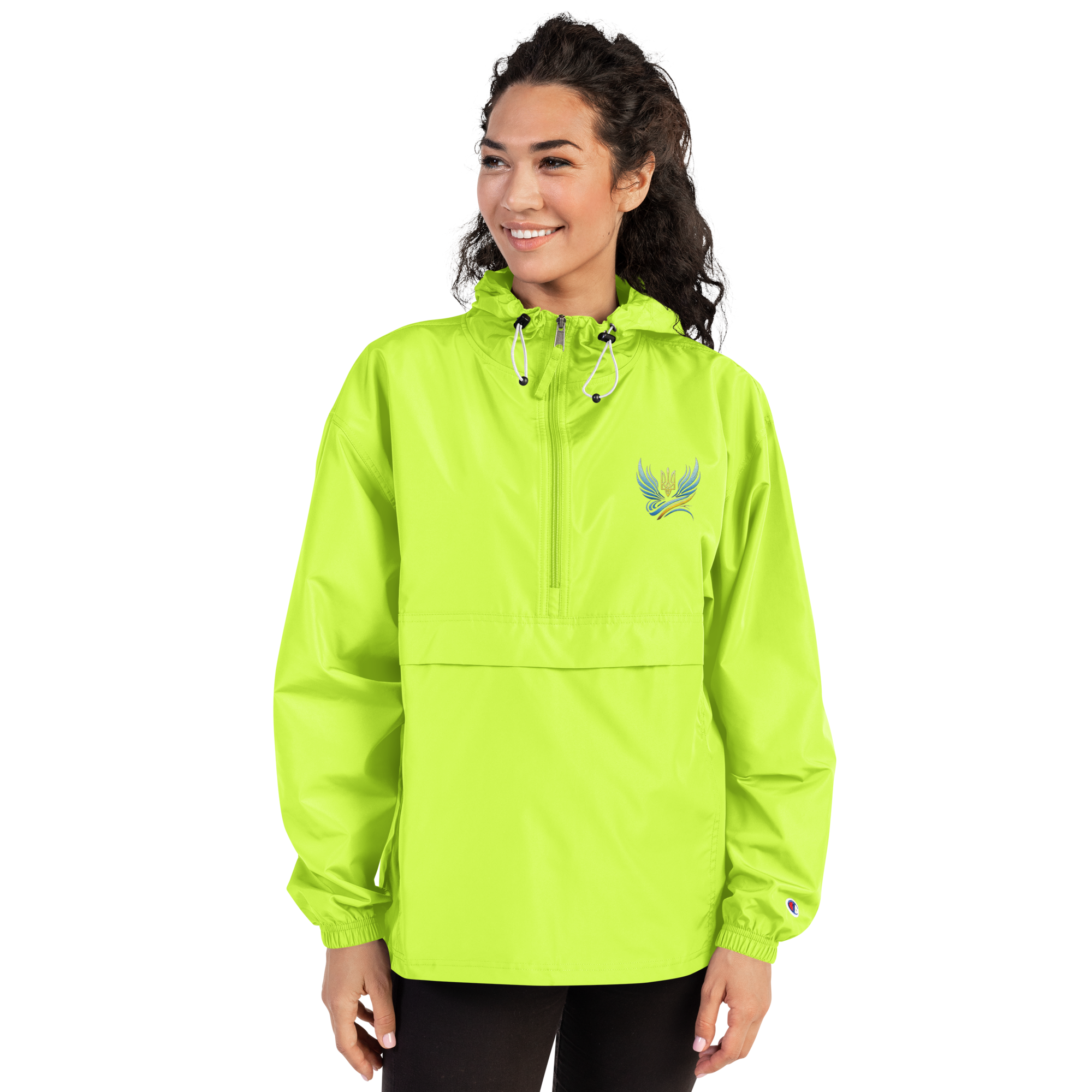 Woman wearing Ukrainian Vibe Trizub embroidered Champion packable jacket, neon green, hood, polyester, wind and rain-resistant.