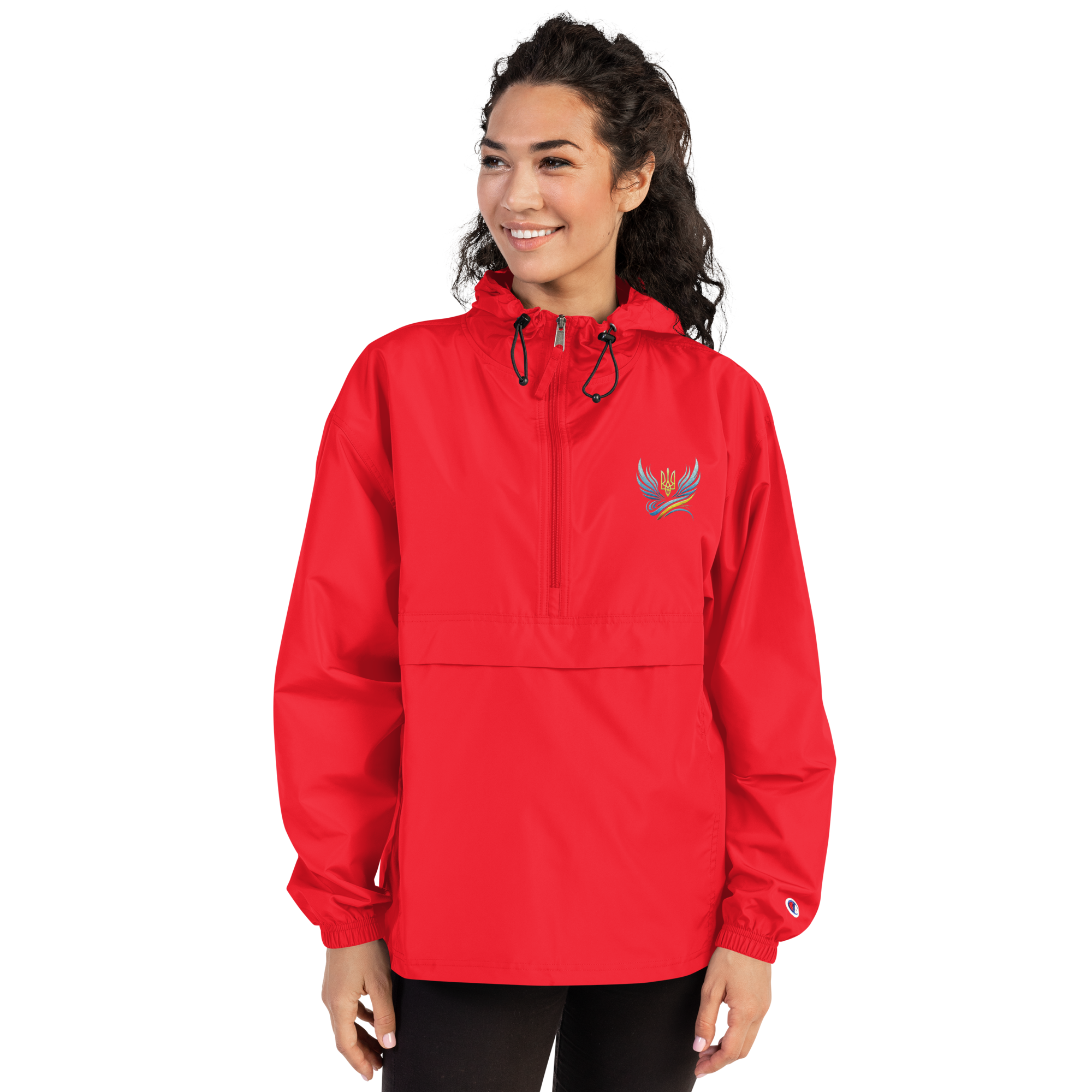 Woman wearing red Champion packable jacket from Ukrainian Vibe Trizub Collection with embroidered Trident logo.