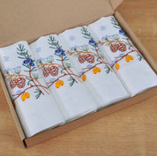 Set of four embroidered linen napkins with Ukrainian floral peony design in a box, complementing the 90x90 cm tablecloth set.