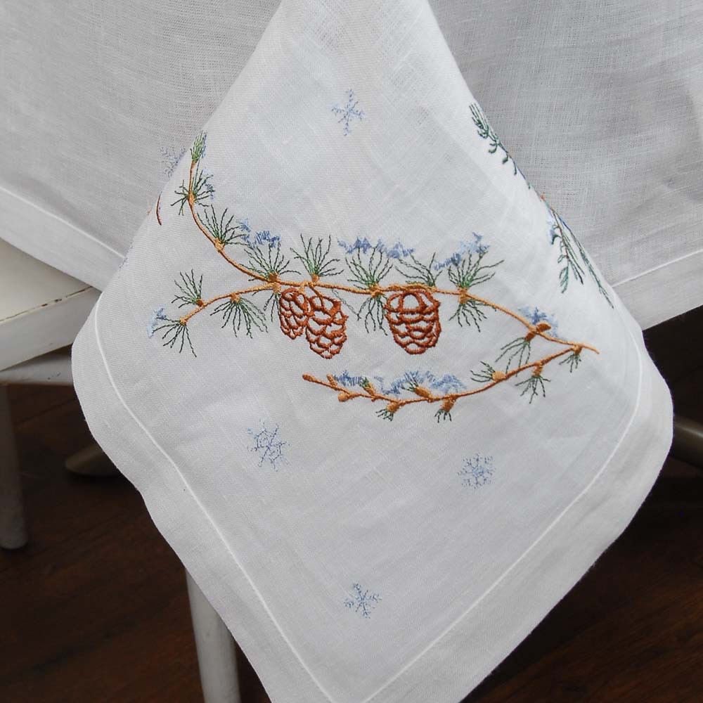 Embroidered linen tablecloth 'First Snow', Ukrainian design with pine motifs, 240 cm, seats 8-12 guests for festive gatherings.