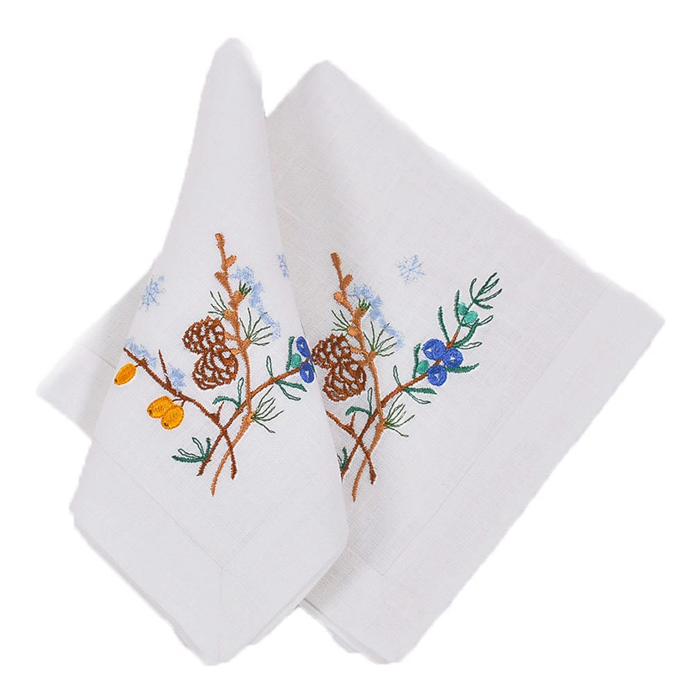 Embroidered linen napkins with floral and pinecone design, complementing the Ukrainian linen tablecloth set.
