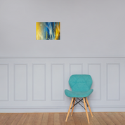 Modern abstract Ukrainian flag poster with Tryzub emblem on a wall above a teal chair in a minimalist room.