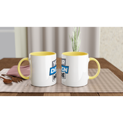 Two Irvelle ceramic mugs with color accents on a plaid tablecloth.