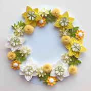 Handmade quilted paper garland with yellow and white flower design, crafted from high-quality craft paper.
