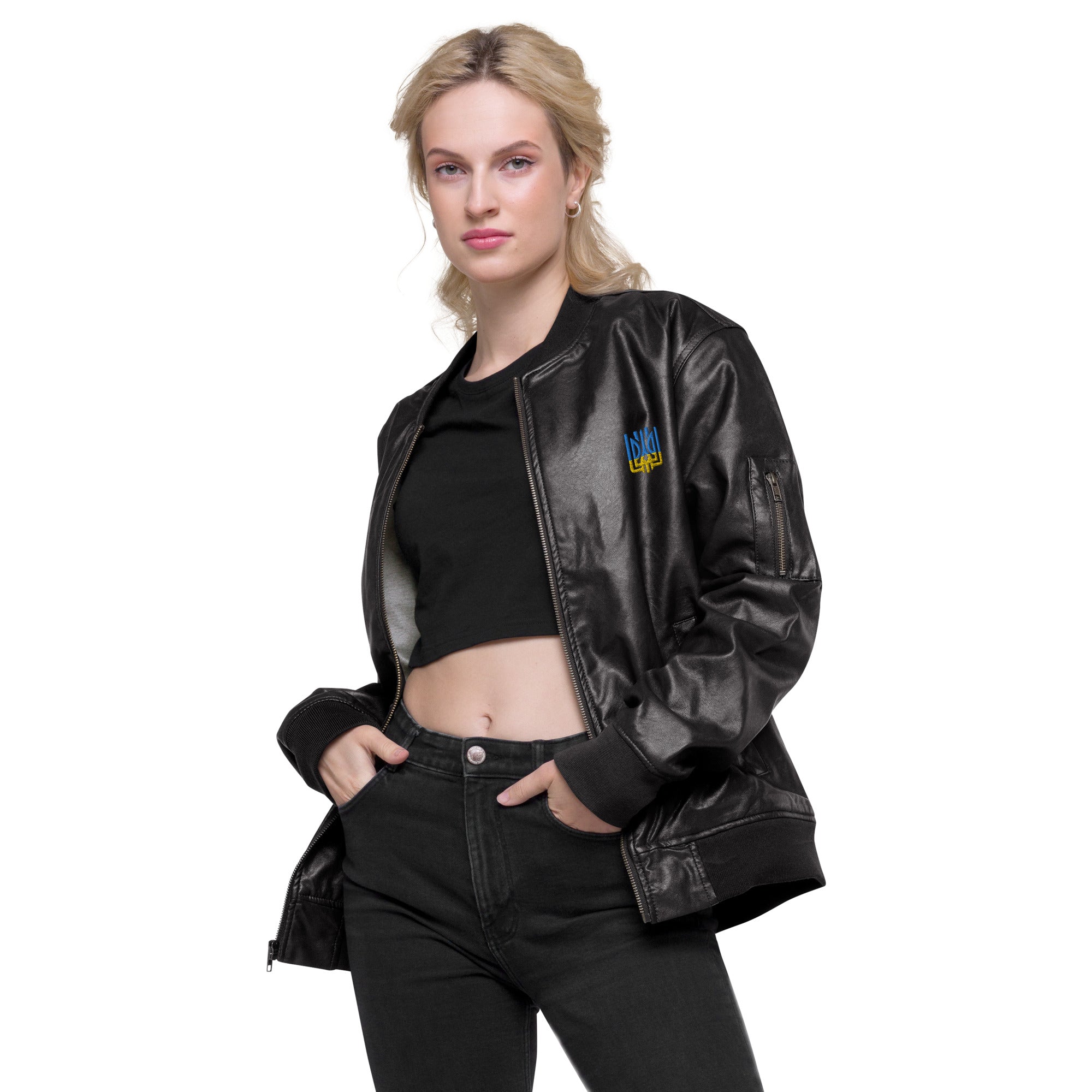 Woman wearing Ukrainian Vibe Tryzub Edition leather bomber jacket, showcasing chic style with blue and yellow embroidery.