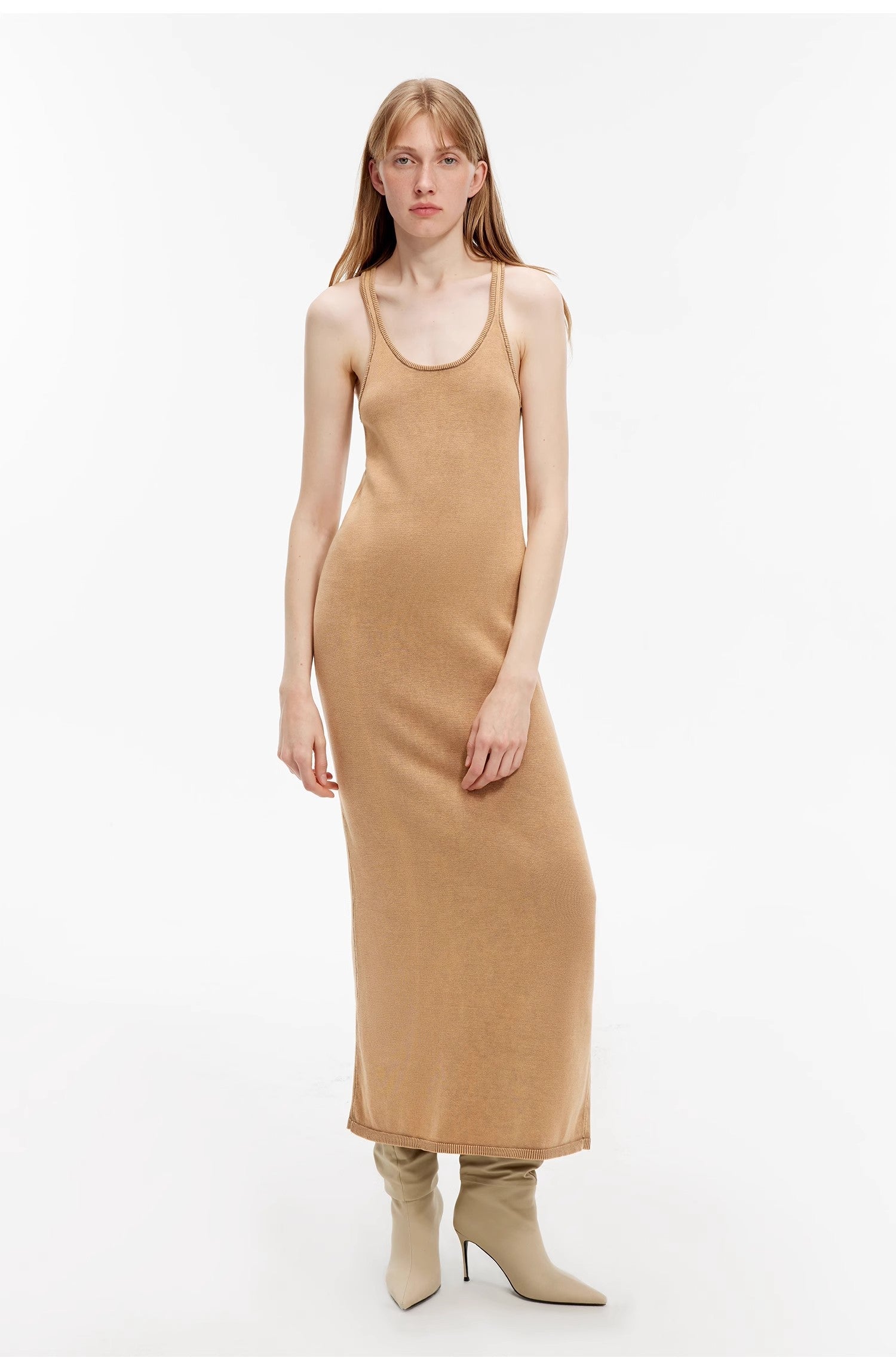 Model wearing Feryn Enzyme-Washed Vest Dress with U-neckline and ergonomic fit, crafted from 100% combed cotton in a soft, muted texture.