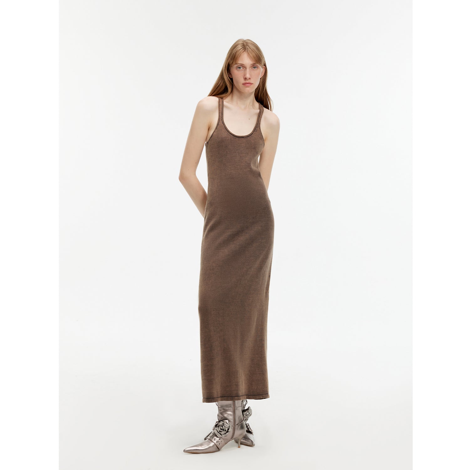 Woman wearing Feryn Enzyme-Washed Vest Dress with U-neckline, made from 100% combed cotton in a muted brown tone.
