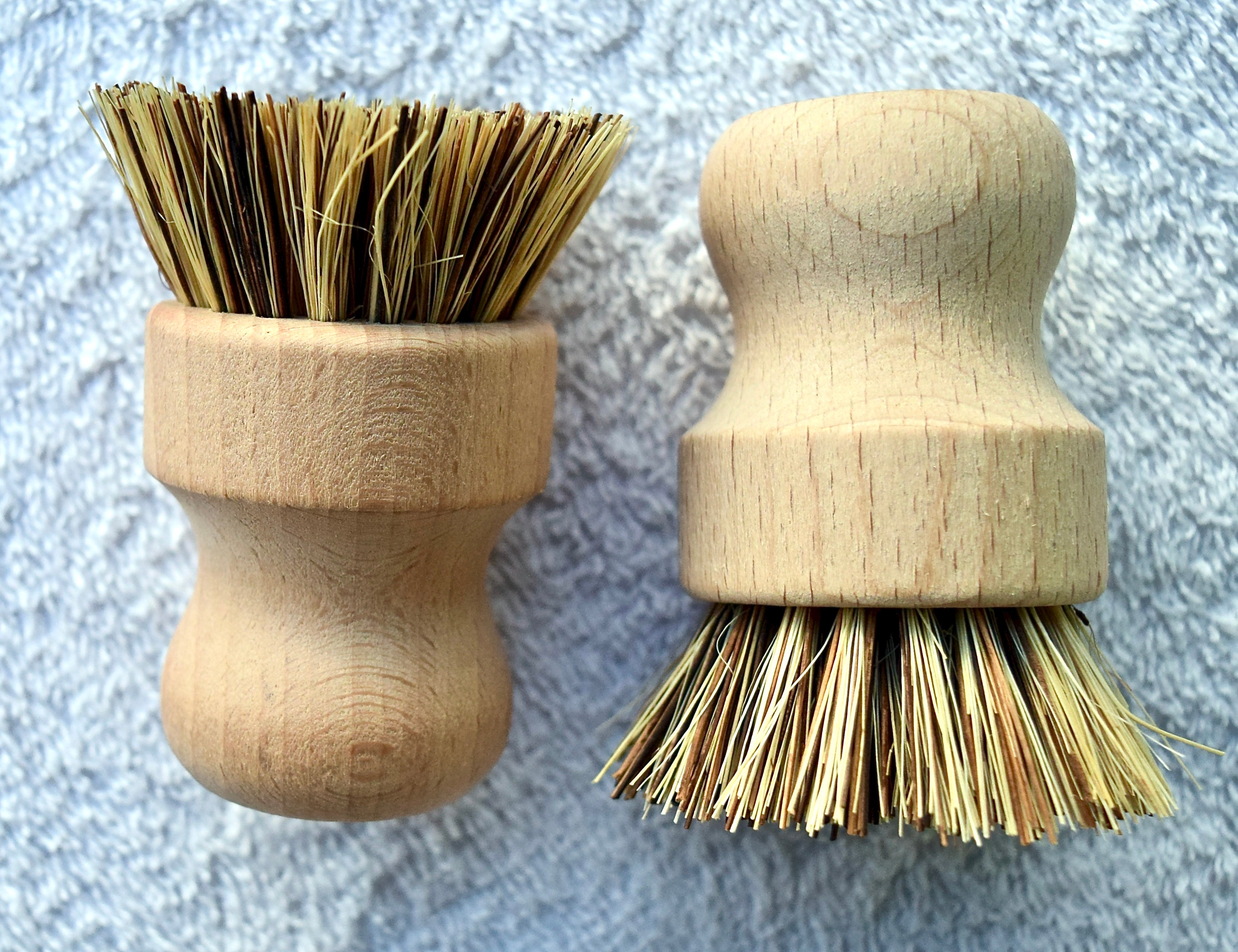 Biodegradable bamboo sisal cleaning brushes with ergonomic handles, ideal for eco-friendly scrubbing tasks.