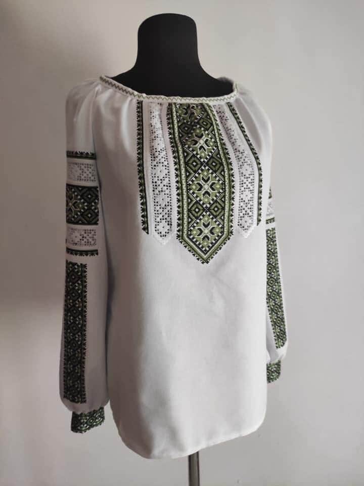 Women's Ukrainian embroidered blouse with green cross-stitch, traditional cotton garment from Galicia.