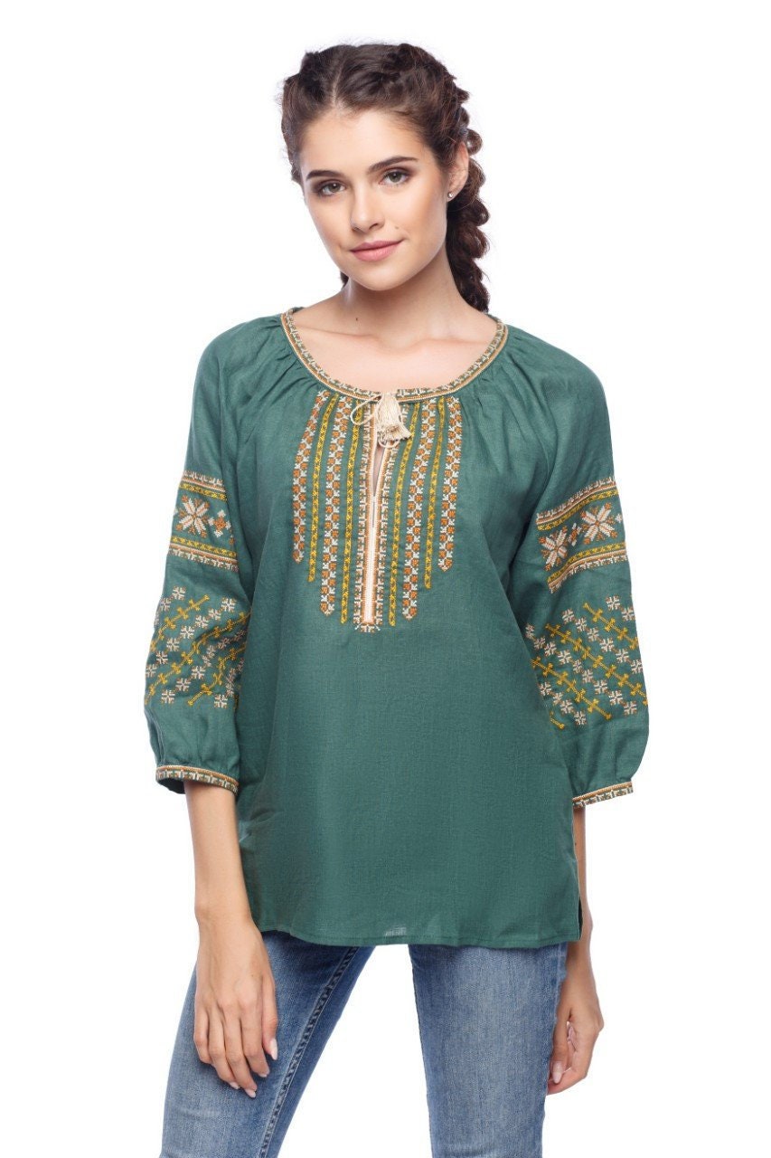 Green linen blouse with Alatyr Star embroidery, featuring boho style and ¾ raglan sleeves, perfect ethnic gift for her.