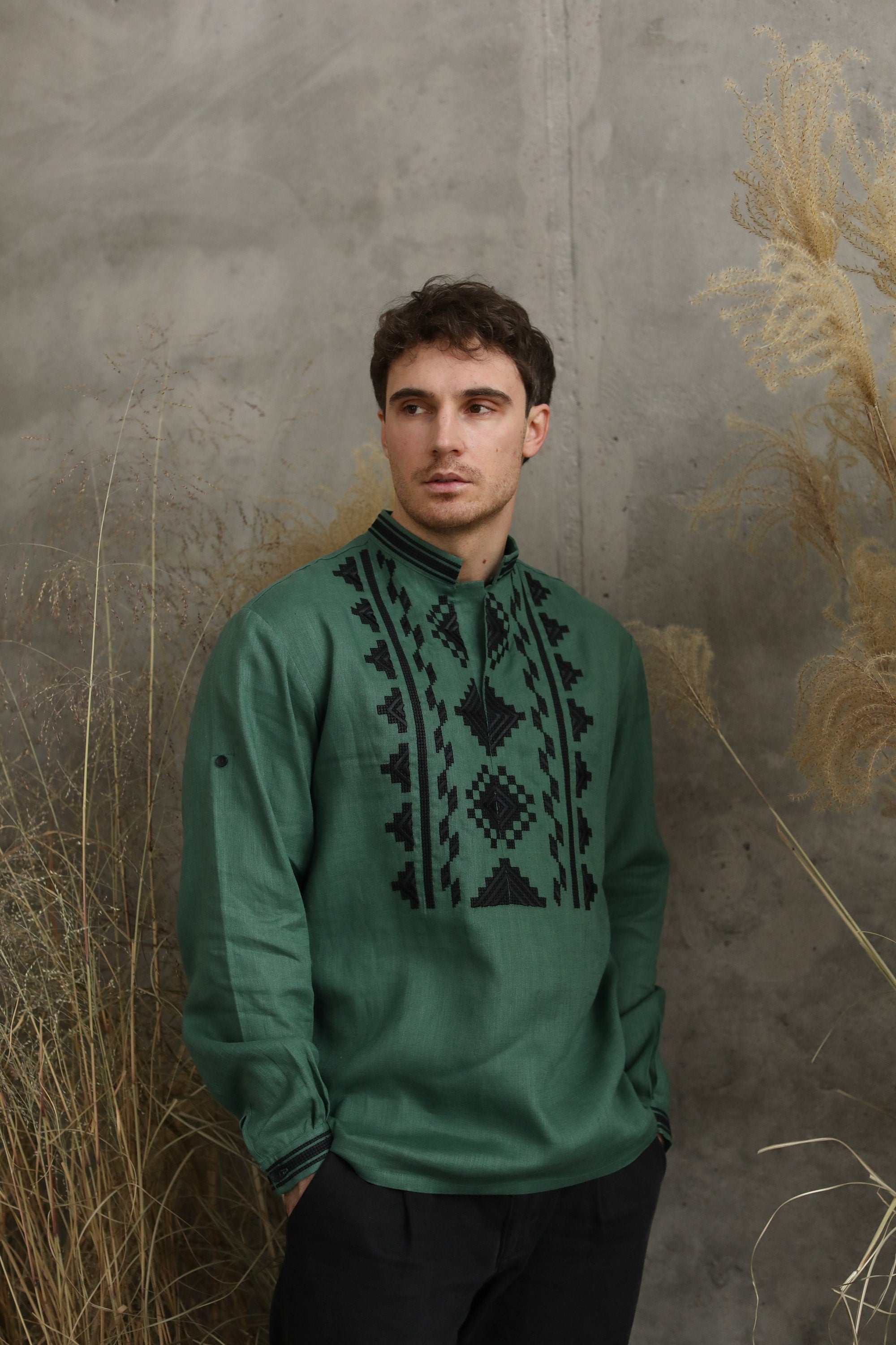 Green linen embroidered Ukrainian vyshyvanka shirt for men, featuring traditional patterns; perfect for cultural events and gifts.