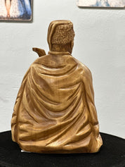 Hand-carved wooden bandurist figurine in linden wood, showcasing Ukrainian traditional craftsmanship.