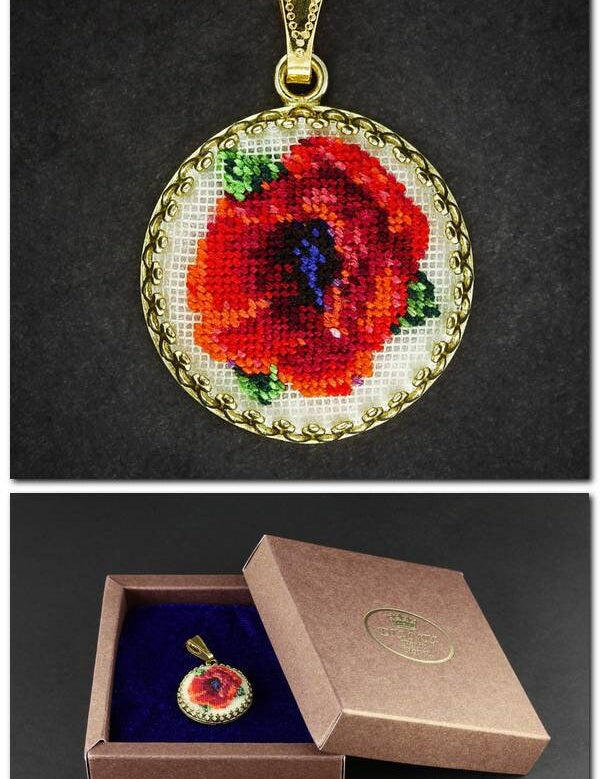 Hand-embroidered floral pendant necklace in box, featuring Petit Point silk embroidery with red and green floral design.