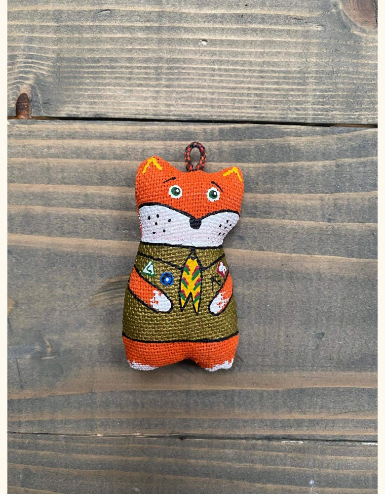 Hand-painted fox keychain in scout uniform, made from eco-friendly vanilla plast, perfect for whimsical decor and souvenirs.