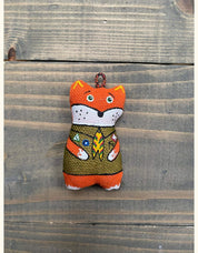 Hand-painted fox keychain in scout uniform made from eco-friendly vanilla plast, a whimsical souvenir from Ukraine.