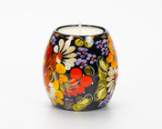 Hand painted Ukrainian tea light holder with Petrykivka floral design in vibrant colors.