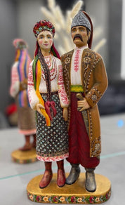 Hand-painted wooden Ukrainian couple figurine, perfect as a wedding or 5th anniversary gift, showcasing traditional folk artistry.