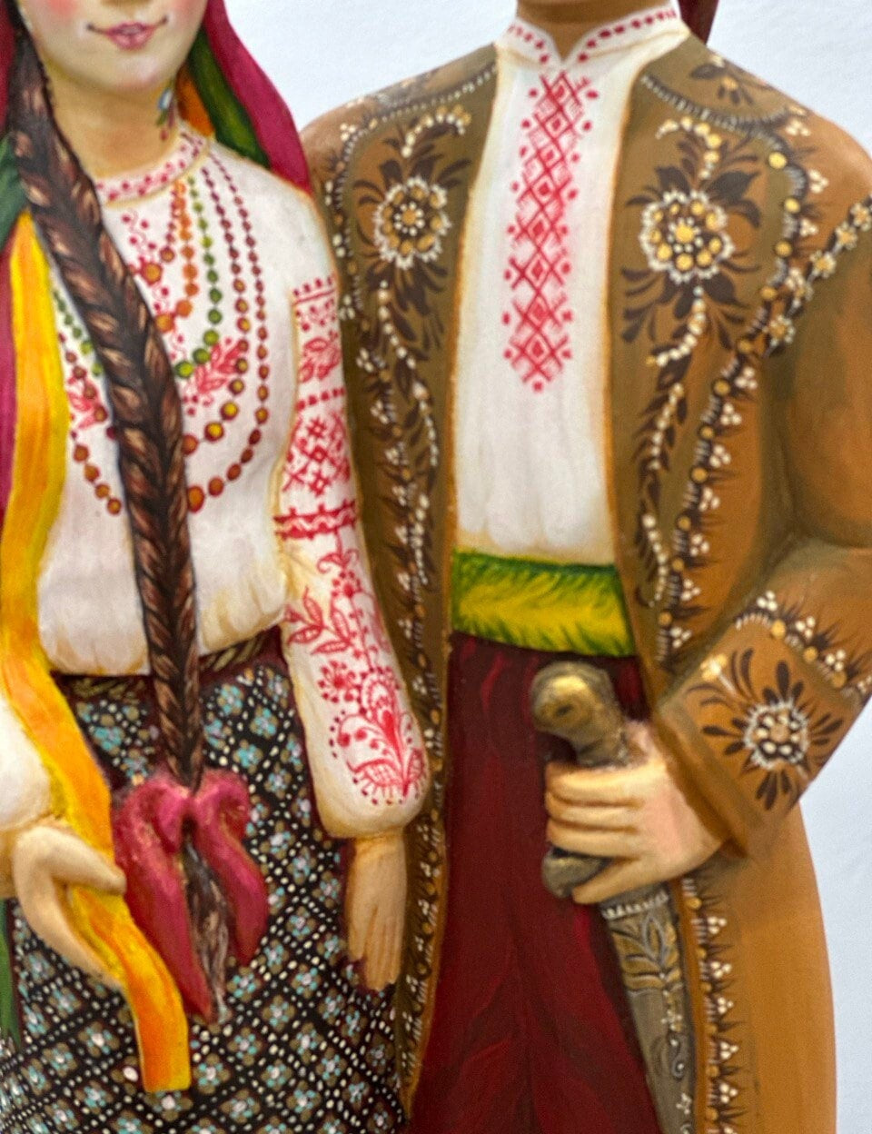 Hand-painted wooden couple figurine showcasing Ukrainian folk artistry, ideal as a wedding or 5th anniversary gift, 35 cm tall.