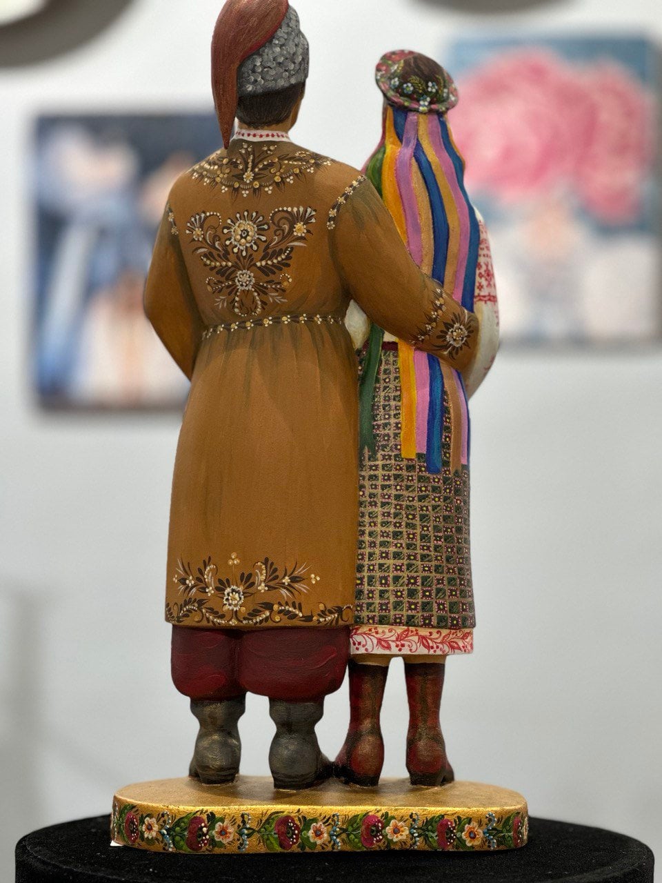 Hand-painted wooden couple figurine in traditional Ukrainian dress, symbolizing love, unity, and craftsmanship, ideal wedding or anniversary gift.
